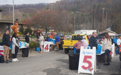Photo of two distribution stations at the BMH 4th Annual Community Drive-Thru Thanksgiving Dinner