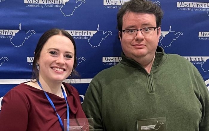 Boone Memorial Health employees Jessica Belcher and James Frame accept awards at the WVCA banquet