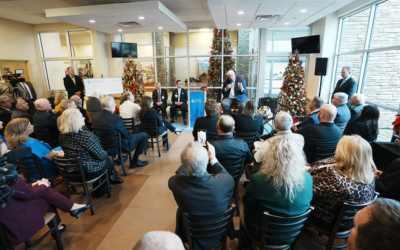 Photo of a group of people watching Governor Jim Justice speak at the Rural Hospital Award Presentation