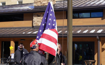 Veterans raising the flag at the 2025 BMH Veterans Day Memorial and Flag Raising Ceremony