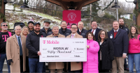 T-Mobile representative presents $50,000 check to BMH and Market on Main leadership