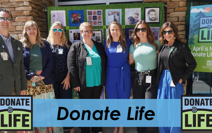 BMH staff members standing together outdoors in front of a Donate Life display, with text overlay reading “Donate Life” and Donate Life logos