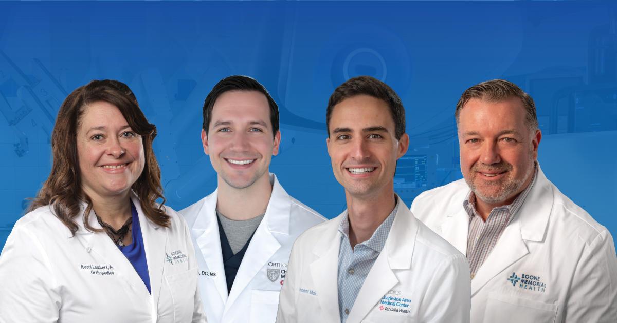 Group portrait of orthopedic and sports medicine providers from Boone Memorial Health and Vandalia Health, wearing white medical coats and smiling toward the camera.