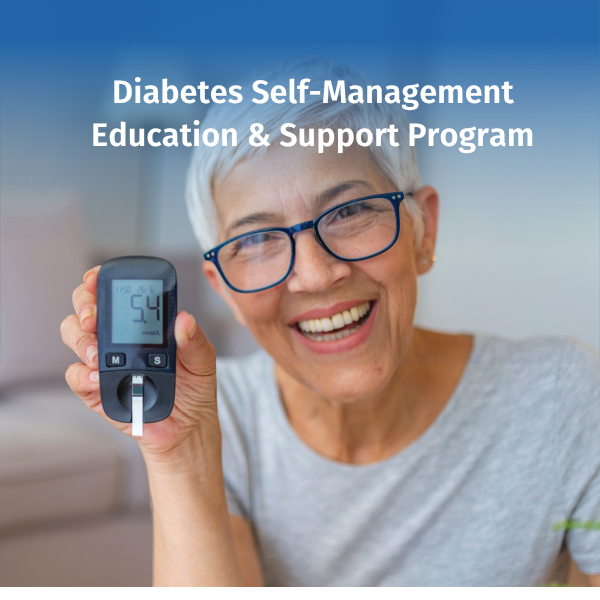 An older woman smiles while holding a blood glucose meter that displays a blood sugar reading. The image represents diabetes self-management, education, and support to help individuals monitor their health and manage diabetes effectively. Text overlay reads “Diabetes Self-Management Education & Support Program.”