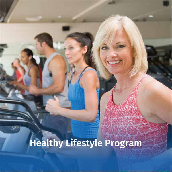 A woman participates in cardiovascular exercise on a treadmill at a fitness facility, with several other individuals exercising nearby. The image represents physical activity and healthy lifestyle habits that support overall wellness and disease prevention. Text overlay reads “Healthy Lifestyle Program.”
